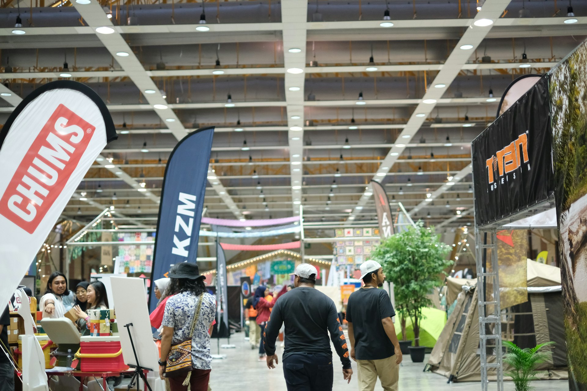 A group of people walking around a store